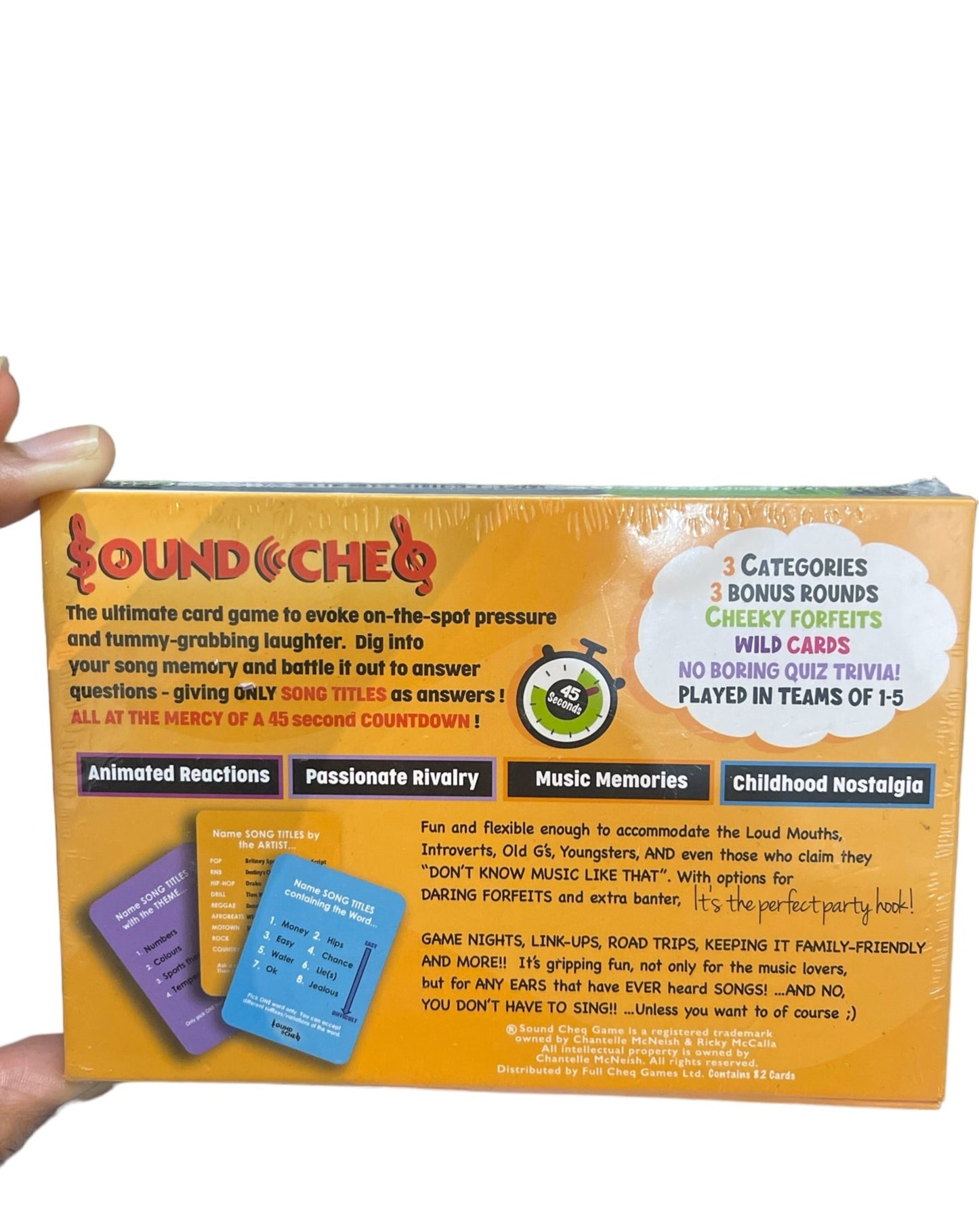 Back View of Sound Cheq Card Game Box-...SOUND CHEQ, The ultimate family friendly CARD GAME for on-the-spot pressure and tummy-grabbing laughter!  dig into your song memory and battle it out to answer questions giving only song titles as answers! ALL AT THE MERCY OF A 45 SECOND COUNTDOWN!